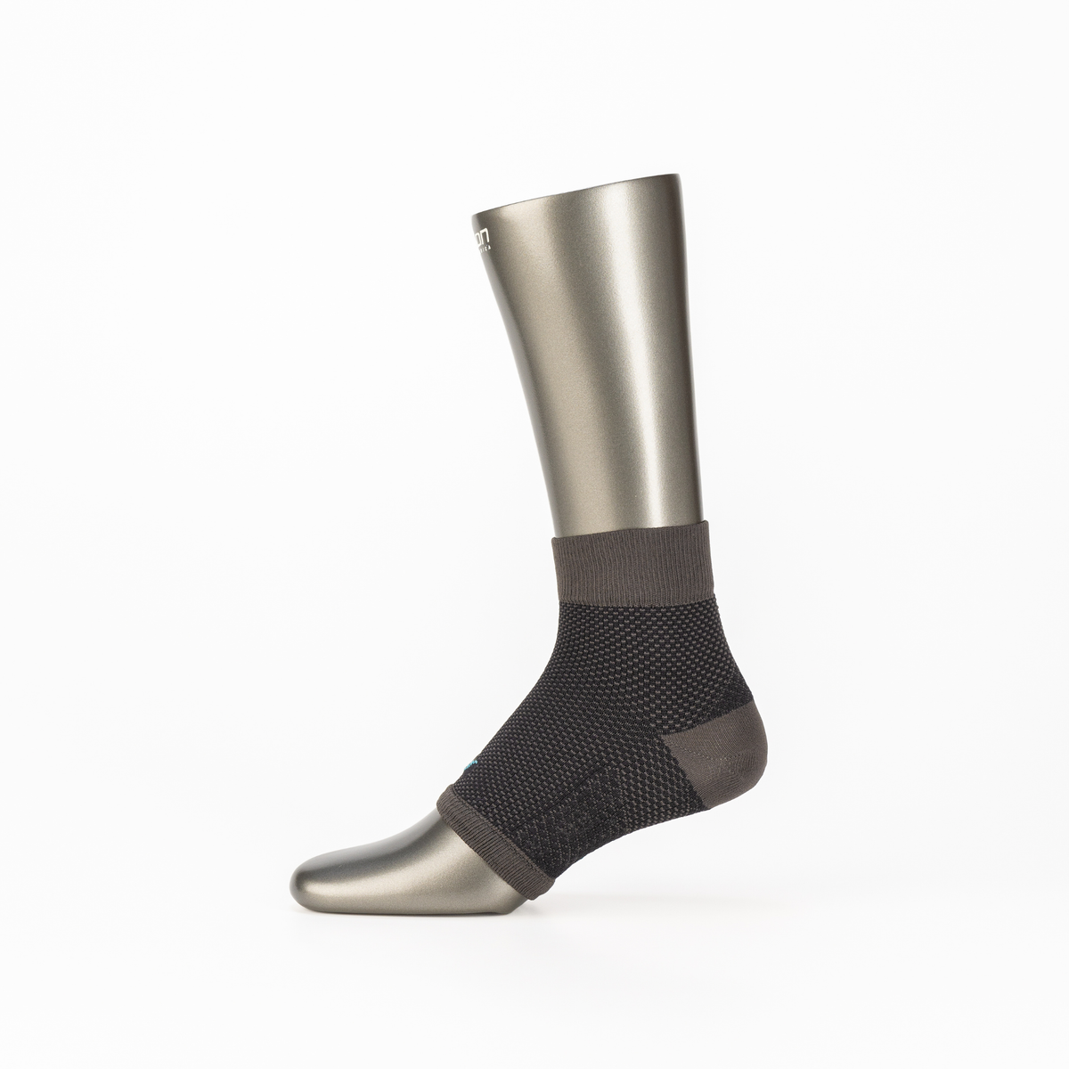 Arch Support Compression Socks in Black & Grey – on a mannequin foot, product photo