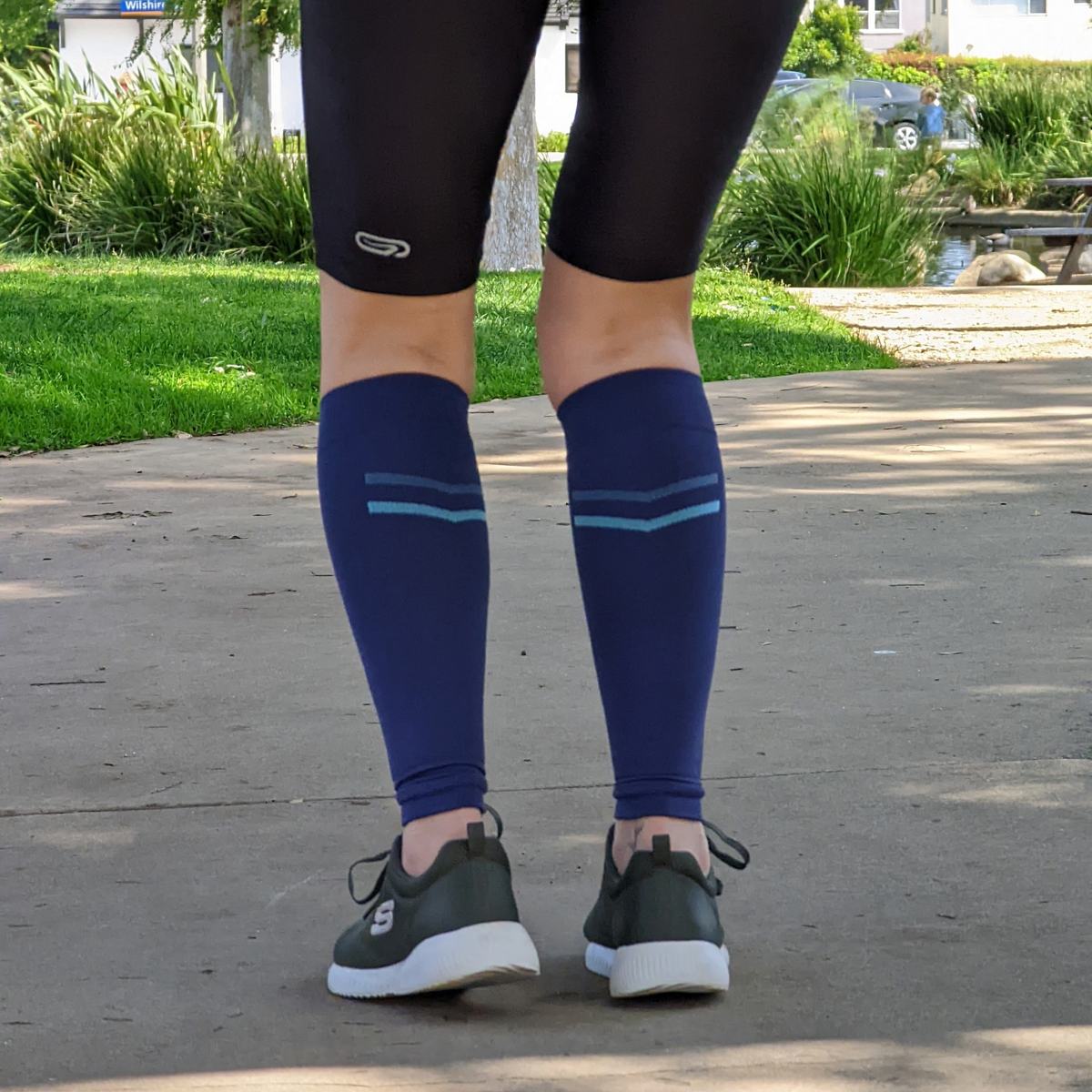 Athletic Compression Calf Sleeves in Blue – worn with sneakers outdoors, lifestyle photo